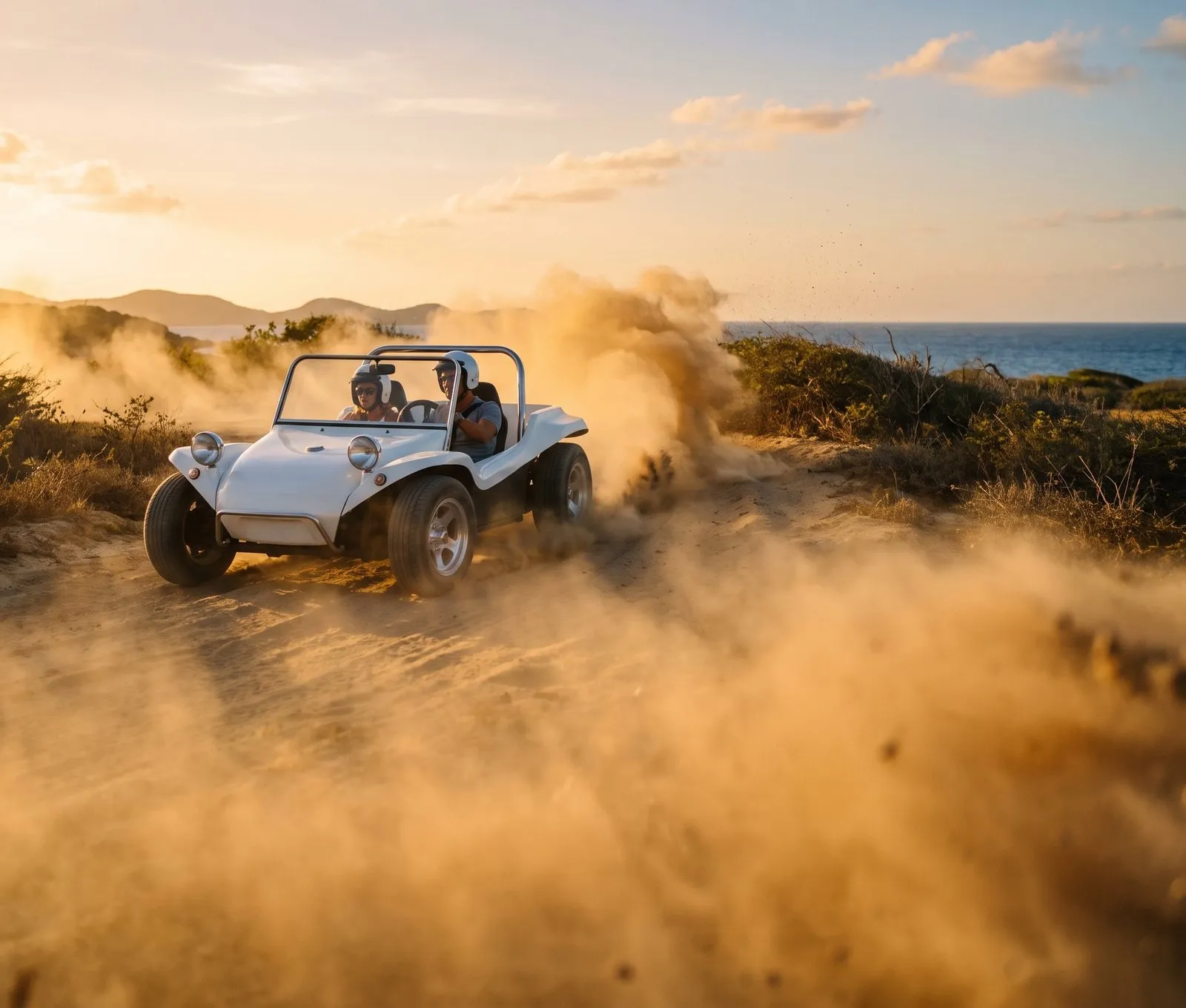 A dune buggy kicking up golden dust at sunset